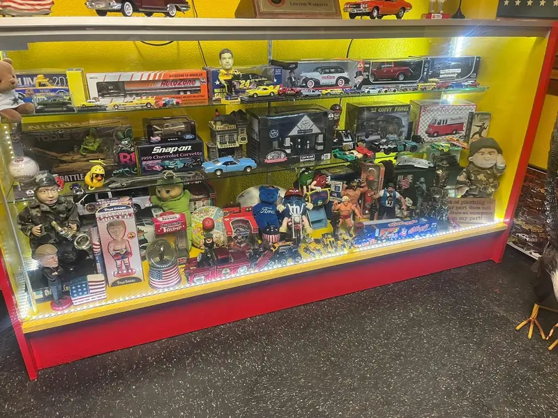 Lighted display case of collectible cars and figures