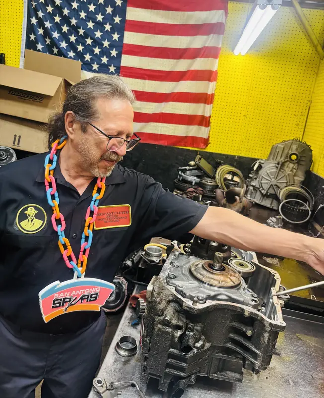 Technician rebuilding a transmission