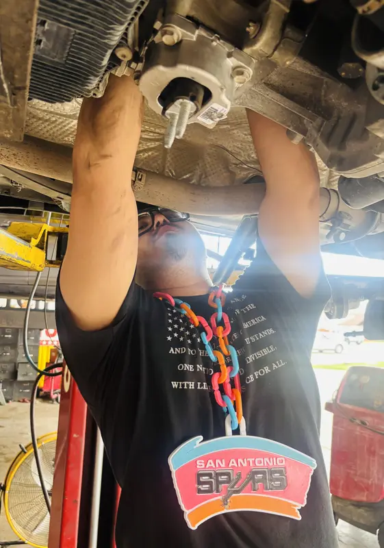 Sergeant Clutch technician working under a vehicle